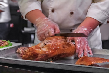 Traditional Chinese Roast Duck or Da Dong Kaoya served tableside at a Chinese restaurant