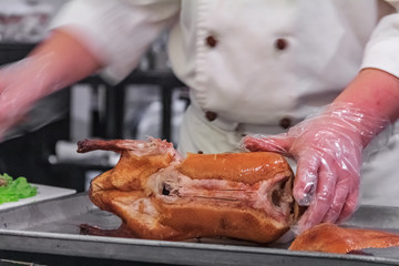 Traditional Chinese Roast Duck or Da Dong Kaoya served tableside at a Chinese restaurant