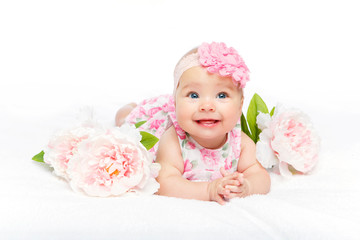 happy beautiful baby girl with flower on head