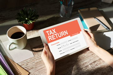 Online tax return application on screen. Business and finance concept.