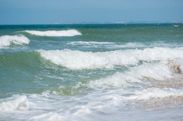 Fototapeta na wymiar Waves on the coast in windy weather close up