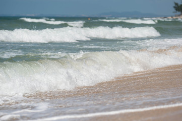 Waves on the coast in windy weather close up