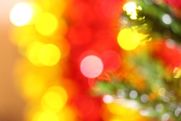 Obraz na płótnie Canvas Blurry christmas tree with bokeh background and copy space