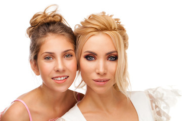 Closeup portrait of two sisters - isolated on white background