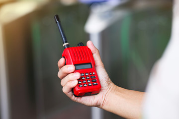 Red radio communication or handheld walkie-talkie.