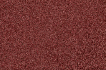 Dark brown matt suede fabric closeup. Velvet texture of felt.