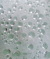 Drops from rain on glass as background