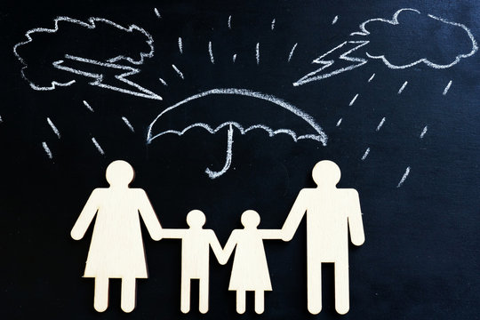 Life insurance. Drawn rain and family figures under umbrella.