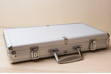 Aluminum suitcase isolated on a white background