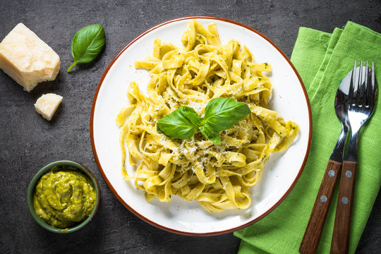 Tagliatelle pasta with pesto sauce and parmesan.