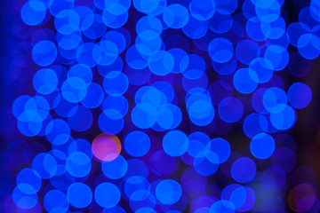 Abstract blue bokeh texture on black background