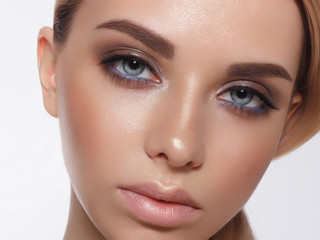 Close-up portrait of sexy young woman with beautiful blue eyes. Woman beauty face portrait with healthy skin. Portrait of beautiful young woman looking at camera. Natural beauty concept