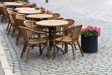 Cozy street restaurant. Tables and chairs in the streets.