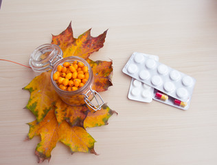 sea-buckthorn berries and autumn leaves, alternative medicine