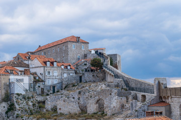 Walkway up to the fortress of Durbrovnik with dramatic cloudscape, Croatia