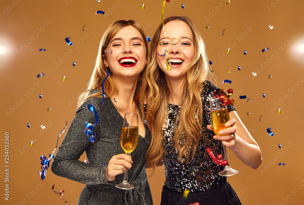 Wall mural beautiful blond women celebrating new year.models having fun at fashion party.happy smiling girls in