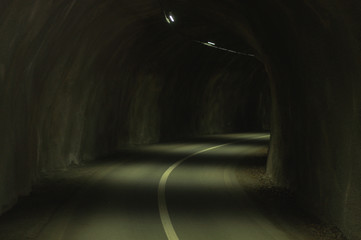 Cycling tunnel interior with concrete walls and lights