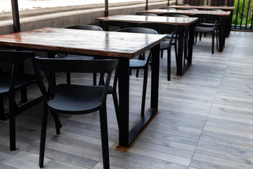 Empty tables and chairs on the riverside with outdoor.