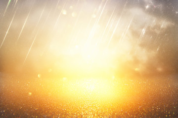 glitter vintage lights background. silver and gold. de-focused.