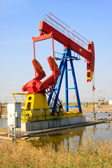 crank balanced beam pumping unit in the JiDong oilfield, China.