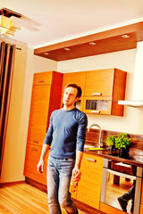 Drunken man holding bottle of whiskey