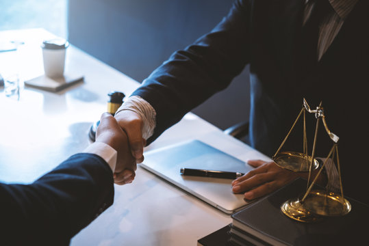 Lawyer business man shaking hands with clients, after finishing up a Consulting for insurance rent house. concept of home protection, family, insurance.