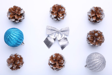 Christmas composition with pine cones and christmas balls on white background