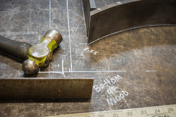 Tools and steel on work bench