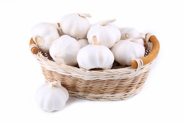 Isolated garlic.Fresh garlic in basket on white background