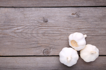Fresh garlic on a grey wooden background