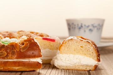 Spanish typical dessert of epiphany  cut piece and  cup of coffe