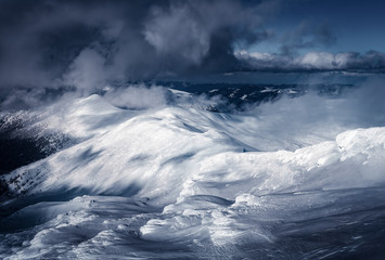 Fantastic winter landscape with snowy hills. Carpathian mountains, Ukraine. Landscape photography