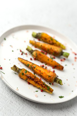 Healthy roasted carrots On white background