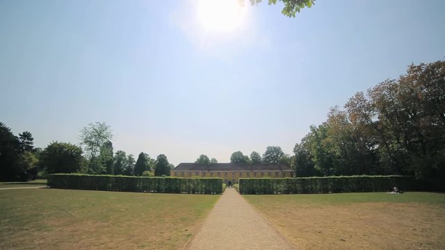 Summer is a beautiful Benrath park in Dusseldorf, Germany. camera movement, view uphill