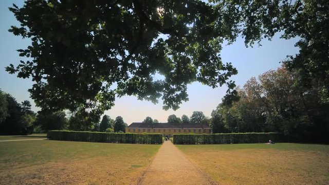Summer is a beautiful Benrath park in Dusseldorf, Germany. camera movement, view uphill