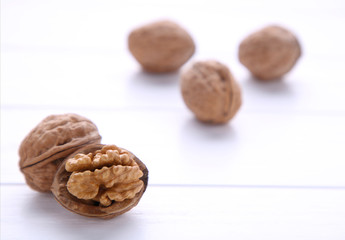 Walnuts kernels on white wooden background. Walnut healthy food