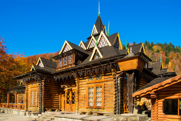 Wooden log building in Carpathian Mountains, Ukraine in Autumn