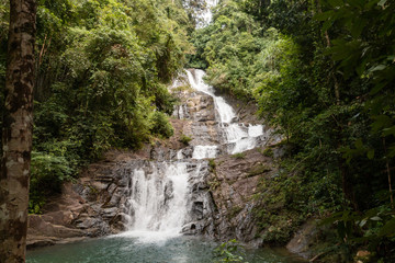 Fototapeta na wymiar A multi level waterfall and cascade in a tropical rainforest