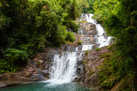 A multi level waterfall and cascade in a tropical rainforest