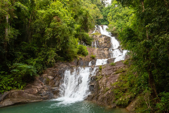 A multi level waterfall and cascade in a tropical rainforest