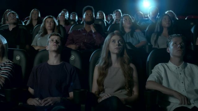 Young Movie Theatre audience watching a movie