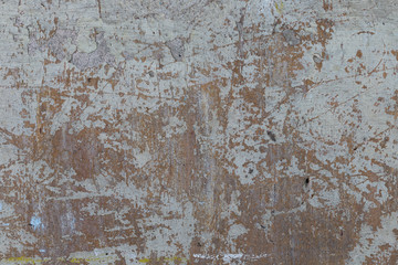 Old plaster walls with remnants of paint. Grunge texture.