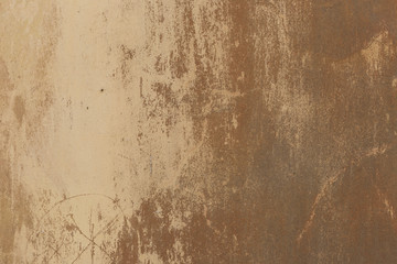 Old plaster walls with remnants of brown paint. Grunge texture.