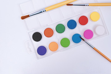 colourful paint palette and brush