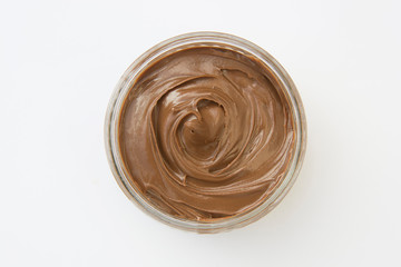 Chocolate hazelnut spread in glass bowl. Hazelnut Nougat cream.