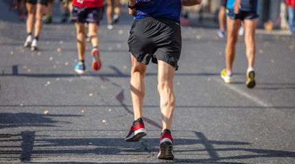 Fototapeta na wymiar Marathon running race, runners running on city roads