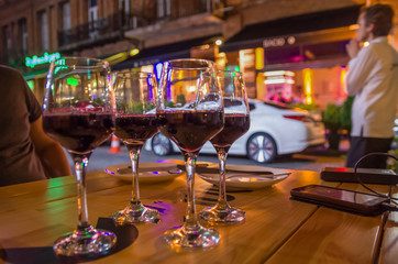 four glasses of wine on the table, evening