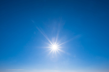 sparkle sun on the blue cloudy sky, nature background