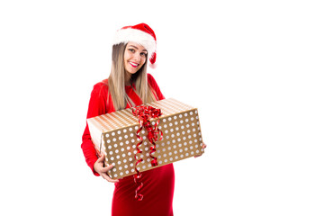 Excited young woman holding a big present over white