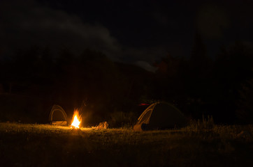 Fototapeta na wymiar night rest with tents, bonfire